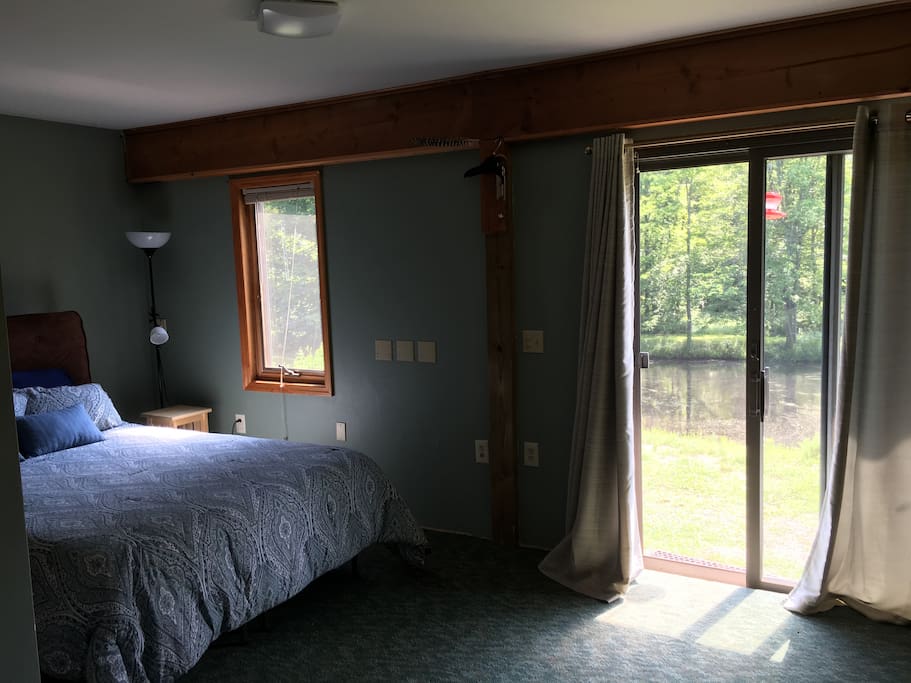 Sliding glass doors looking out over pond