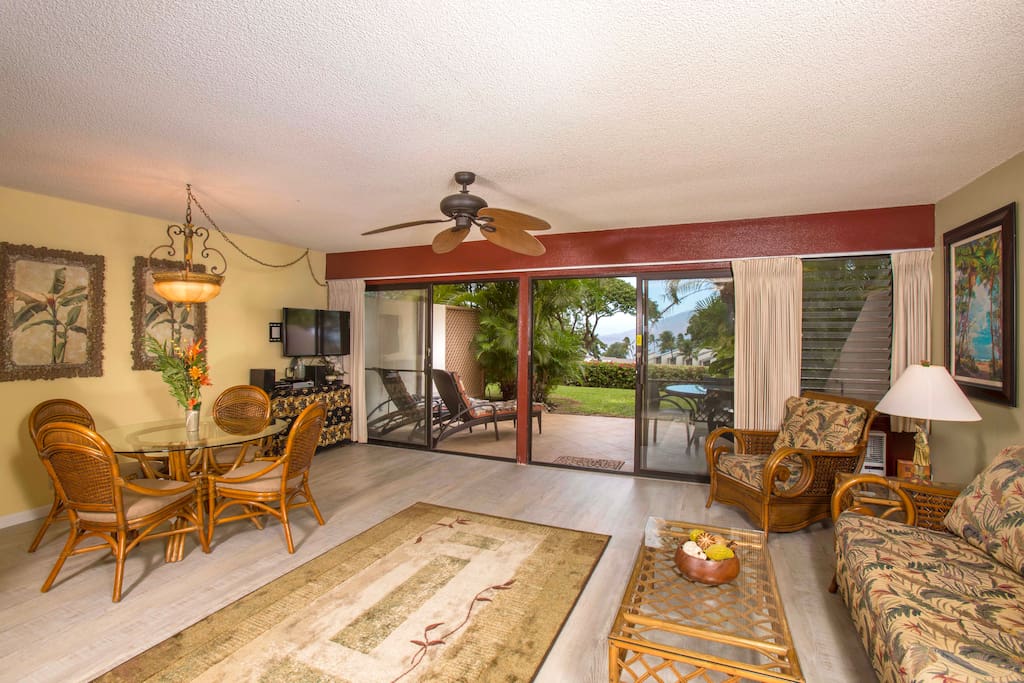 Spacious, air-conditioned living room has new flooring and gorgeous ocean view