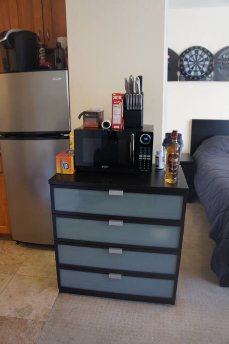 Lots of added amenities for guests - microwave, cutting knives, water filter, also all the cabinets are full of stuff to use (detailed in another photo)