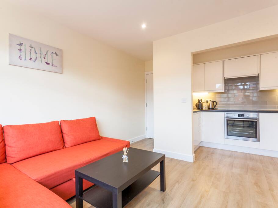 Another view of the living room and kitchen.