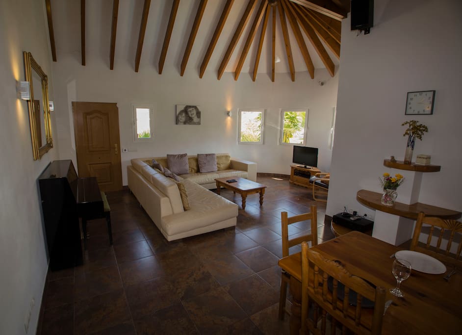 Living room, spacious and open plan with feature ceiling