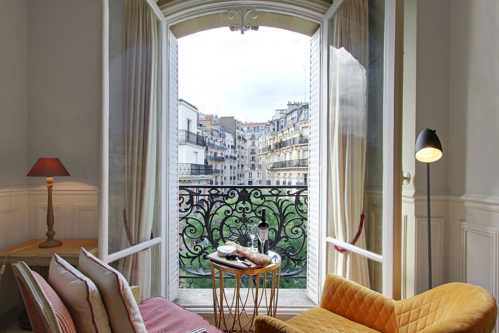 The two small balconies from the living room afford lovely views at any time of day or night onto the beautiful treelined street below.