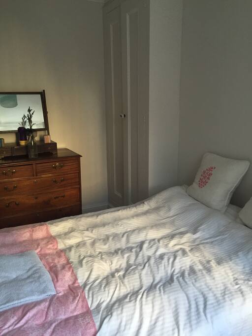 Comfortable, quiet double room with 2 wardrobes,chest of draws and 4 bed draws, window,next to a bathroom with a shower.