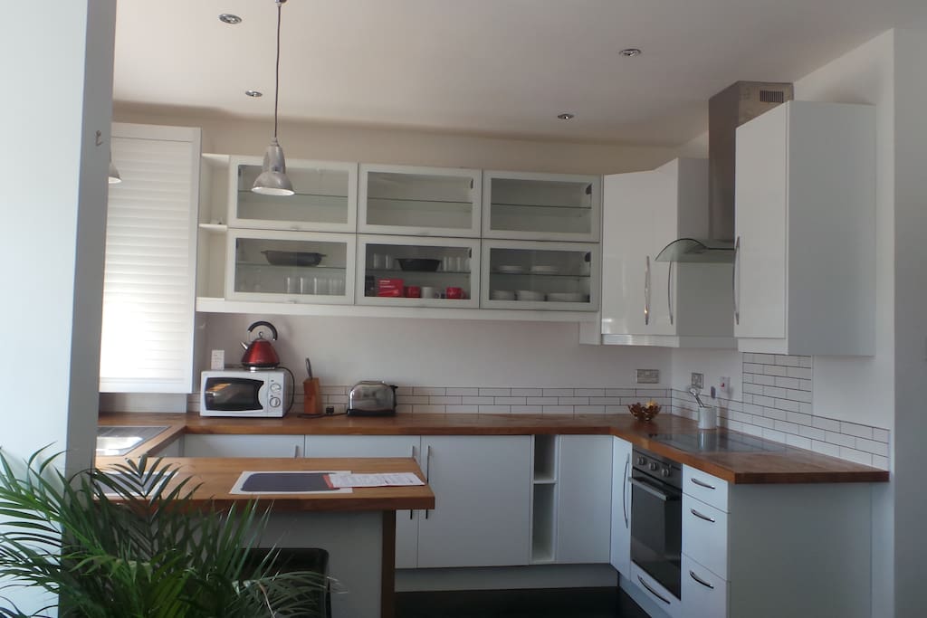 Large kitchen with built in Fridge, Freezer and washing machine.
