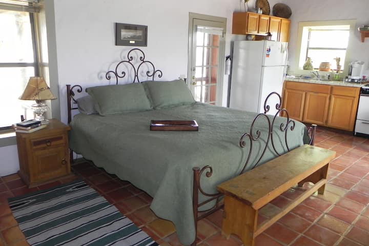 The king size bed is outfitted with nice cotton linens. The kitchenette is fully equipped with all you will need to cook a meal or simply heat something in the microwave oven.
