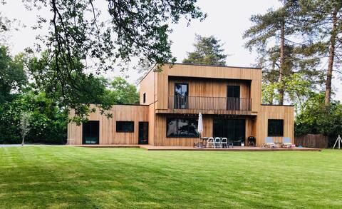 Wooden house designed by an architect, spa pool