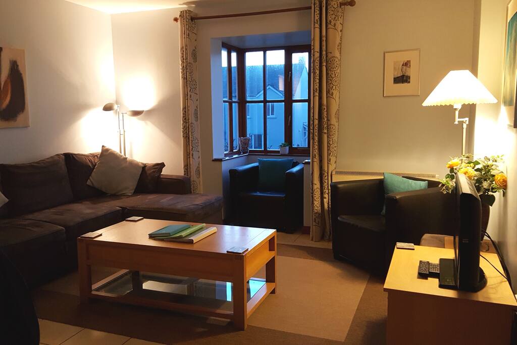 Cosy, fresh interior with a glimpse of the beach from the window seat.