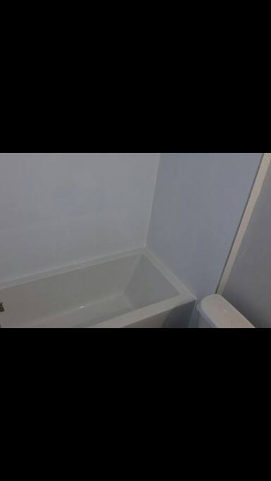 Brand new soaker tub and ceramic tile for the most enjoyable bath or shower.