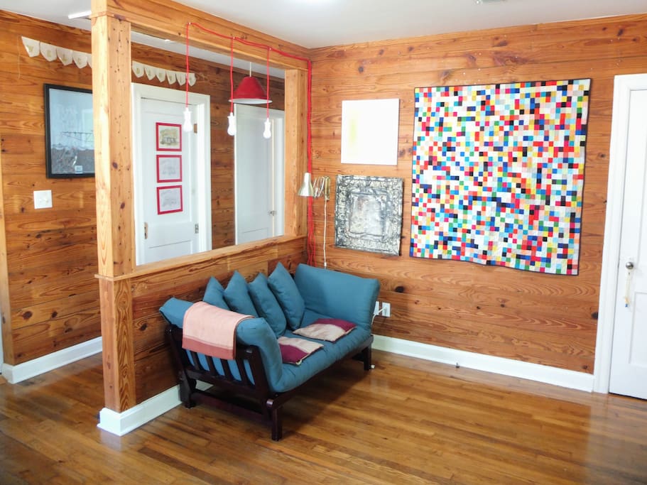 This turquoise couch folds down into a sleeper for one person -- perfect in a pinch.
