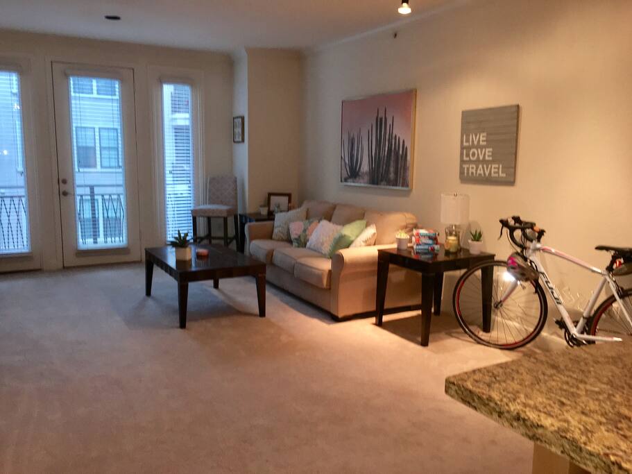 Living room with lots of flexible space - comfortably fits two queen-sized air mattresses