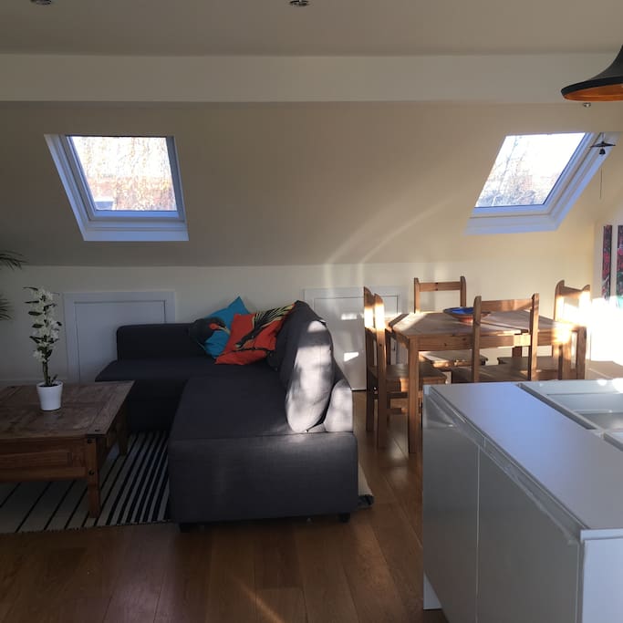 Open plan living room with brand new designer Italian kitchen