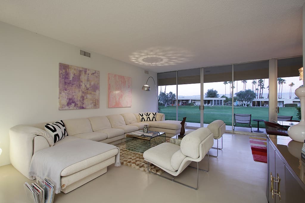 Living Room with all mid-century modern furnishings and view of golf course