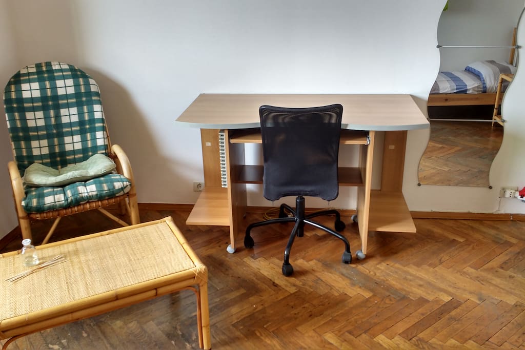 armchair and coffee table, desk with office chair, mirror