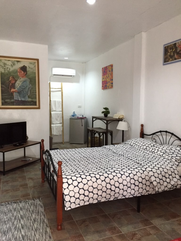 Each room has a quiet split unit Air-con and each room feature unique local and Asian Art as well a a private refrigerator and TV with Satellite feed