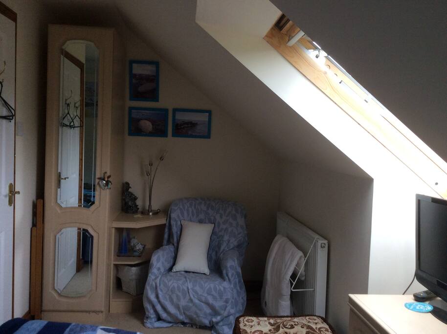Wardrobe and chair in bedroom