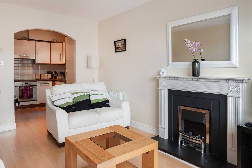 Bright Spacious living room with a view into the Kitchen