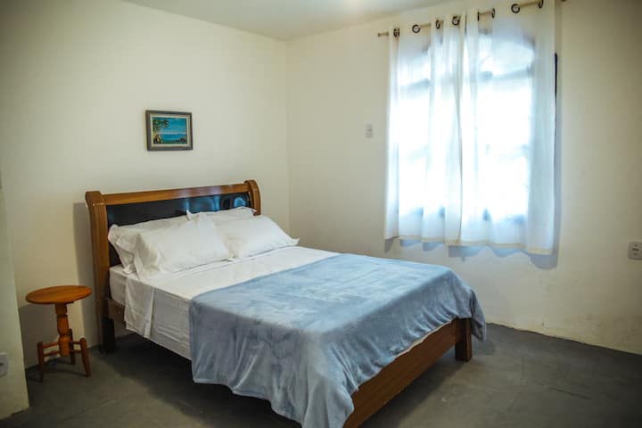 JACKFRUIT suite with 1 double bed and ceiling fan.