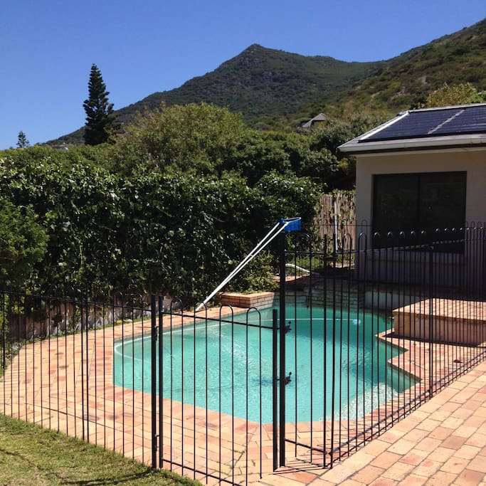heated swimming pool against mountain backdrop
