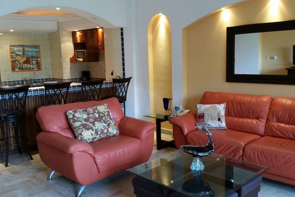 Living Room Opens to Kitchen and Balcony.