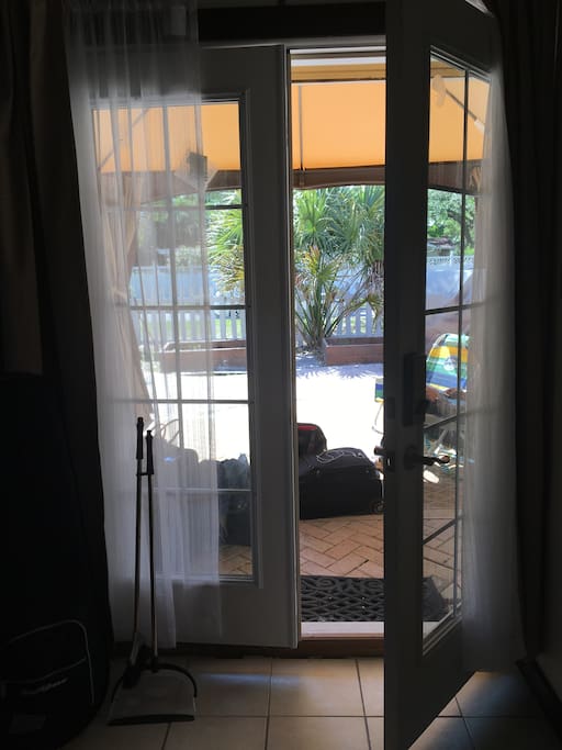 French doors open the cottage to the patio