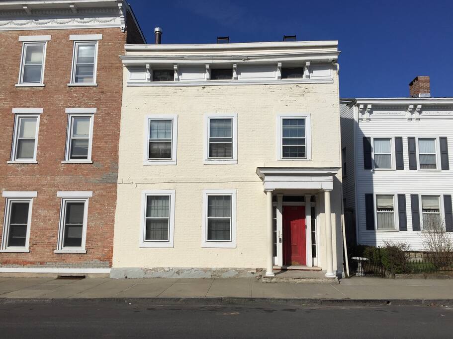 Front of the house. Guest can use the front or rear entrance. The rear goes directly into the apartment and can be easily accessed from your parking spot.