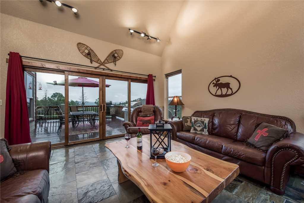 Easy Access - The living room provides quick and easy access to the outside deck where you can sit and enjoy the cool breeze and