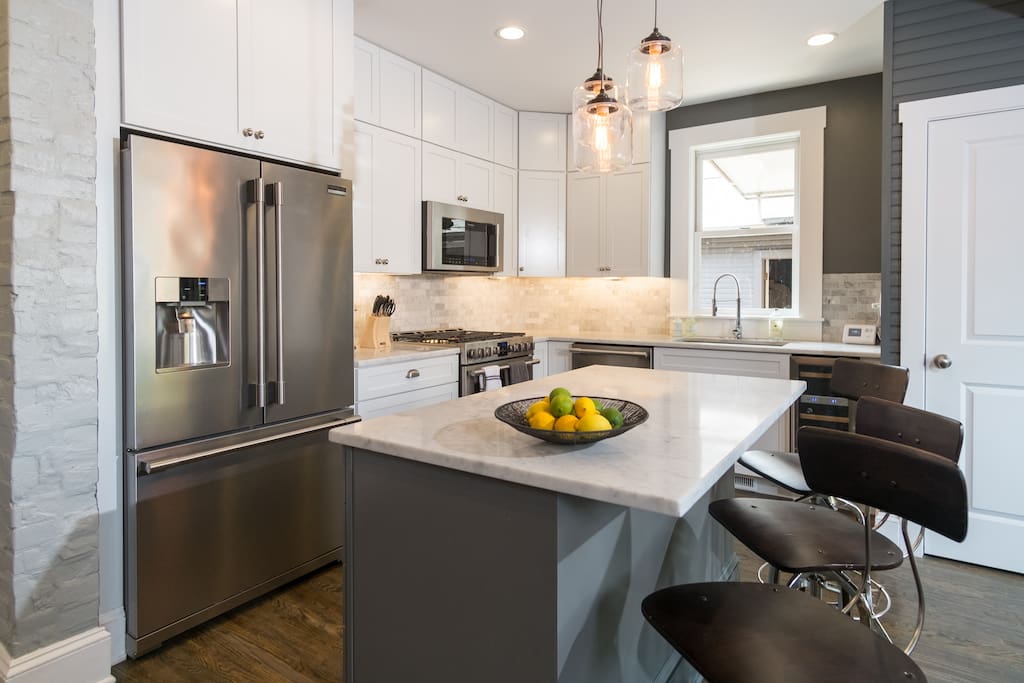 Fully equipped cooks' kitchen with Carrera marble and stainless steel professional grade appliances