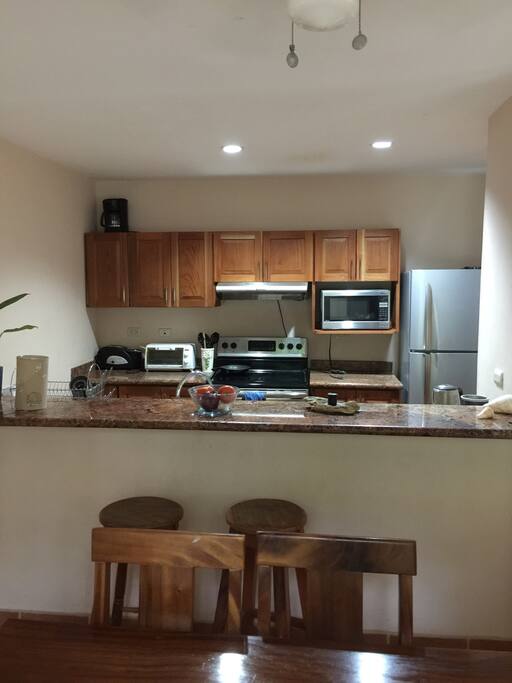 Galley kitchen with stools