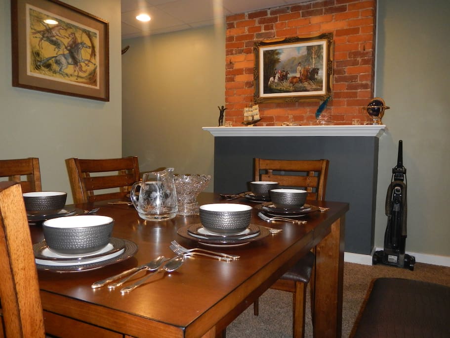 Spacious dining area with seating and dinnerware for six enables you to host additional guests to dinner