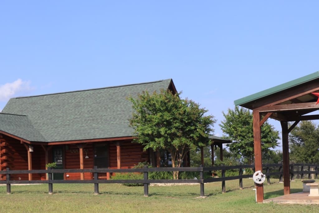 The Log Cabin is located on a gated 47 acre ranch. You will enjoy panoramic views on 3 porches.
There is a large stocked fishing pond for guests. Bring your own tackle for catch and release fishing. The cabin is furnished with leather sofas, two bedrooms with comfortable bedding and adjoining baths, a sleeping loft with full futons and a fully equipped upscale kitchen.