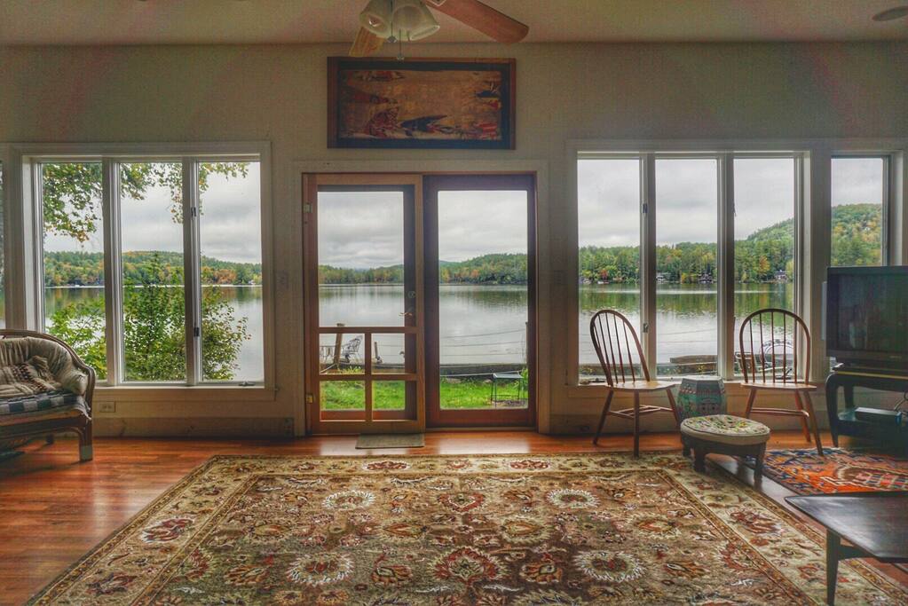 Living room, gazing out over the pond into the start of foliage