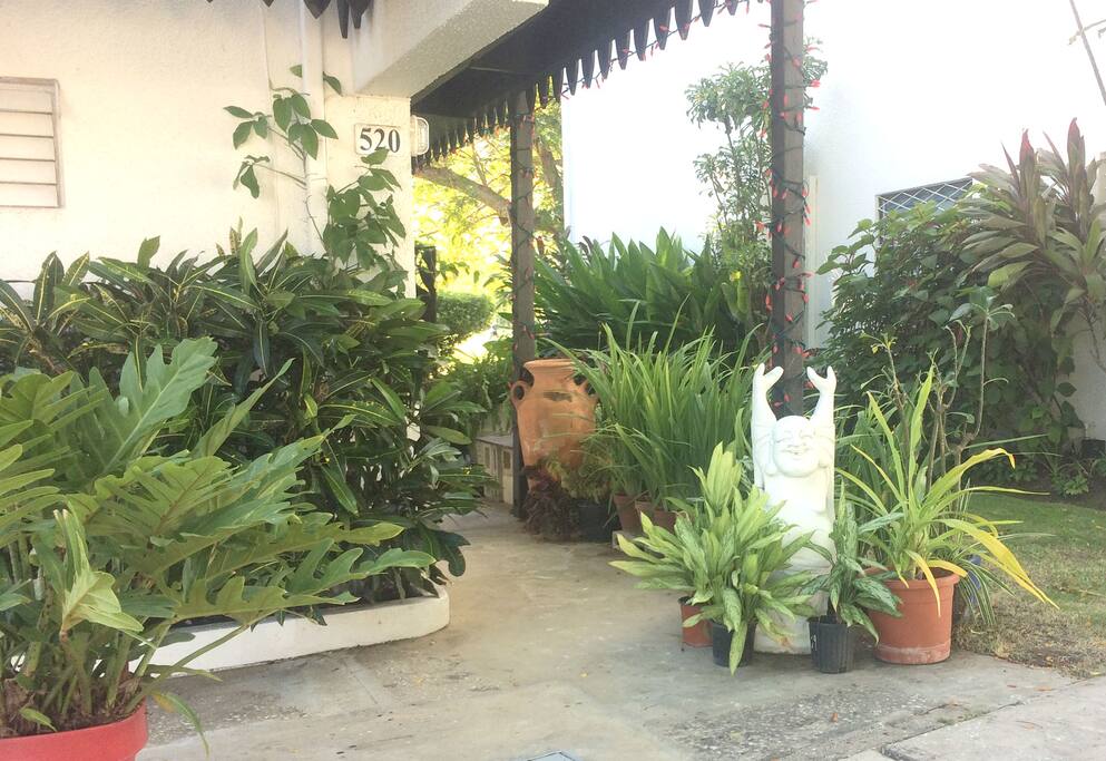 A laughing Buddha welcomes you to your home away from home in Barbados!