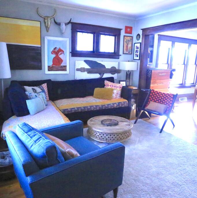 Living room with cozy sectional and television.
