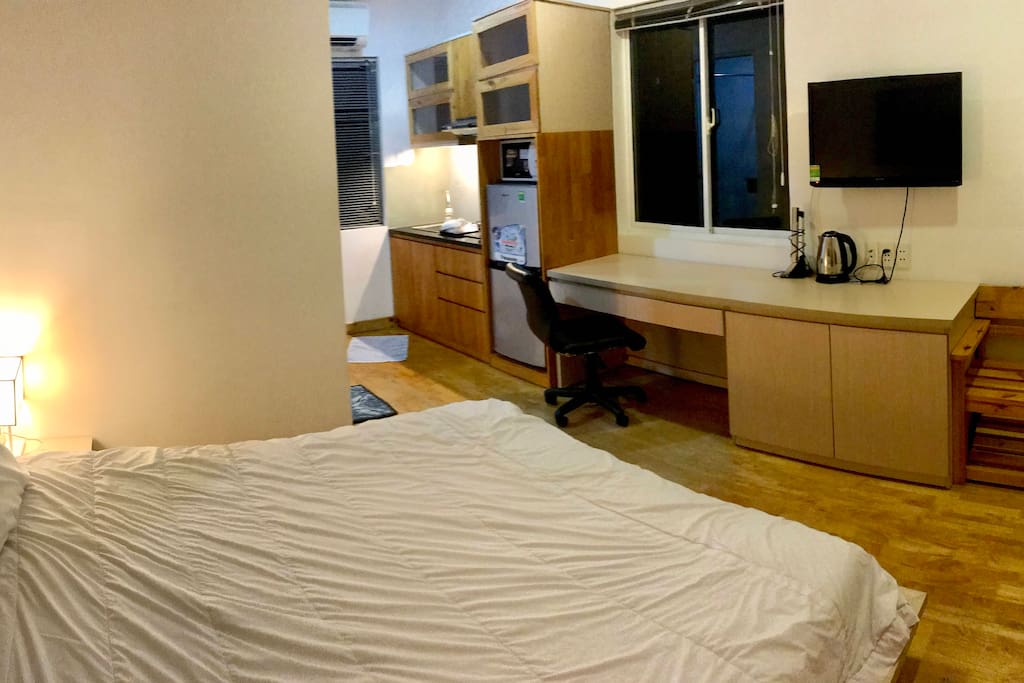 King-sized bed in cozy space