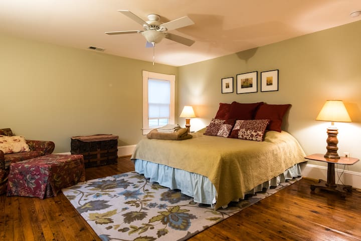 Upstairs private bedroom with king sized bed and room to sleep a small child