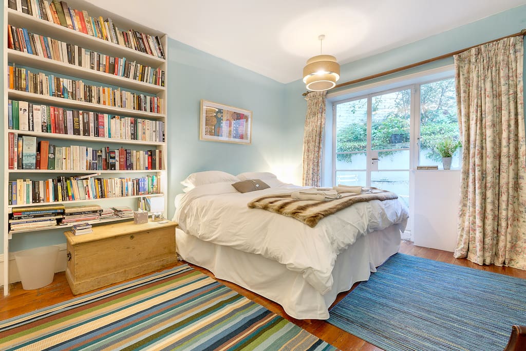 Spacious bedroom with super kingsize bed - and lots of books!