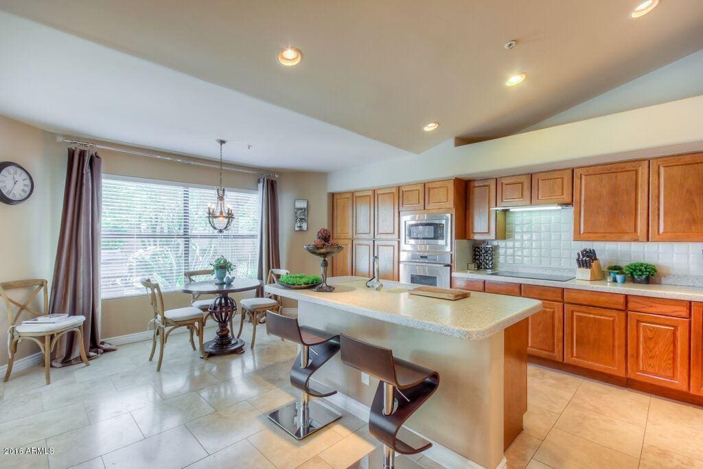 Kitchen accessorized with stainless steel appliances and brand new! Trial at the counter on swivel stools or sit still at the table