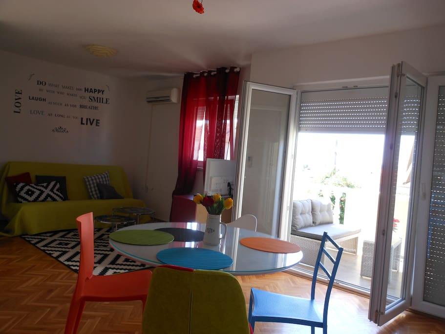 ew from the kitchen to the living room, dining room and a sunny balcony