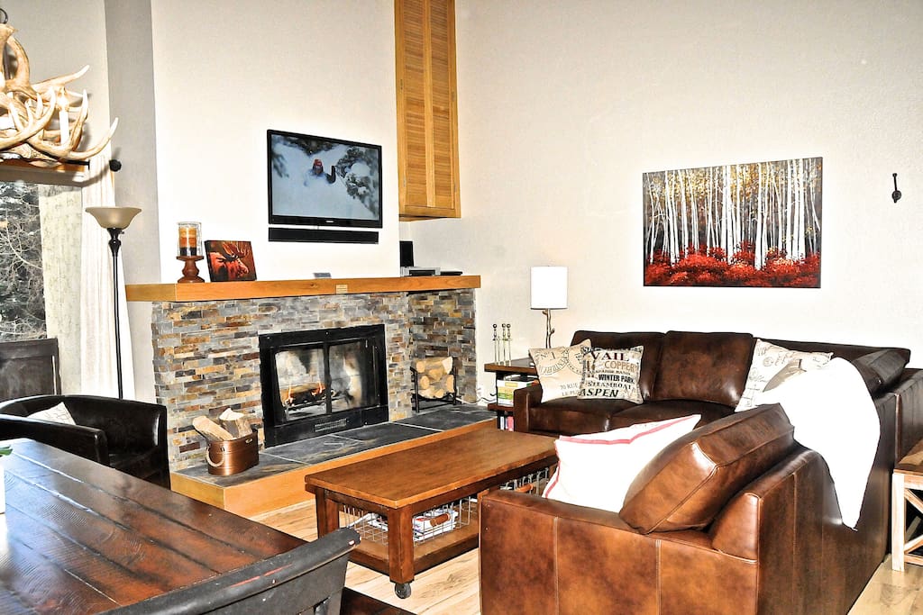 Living/dining room with vaulted ceilings.