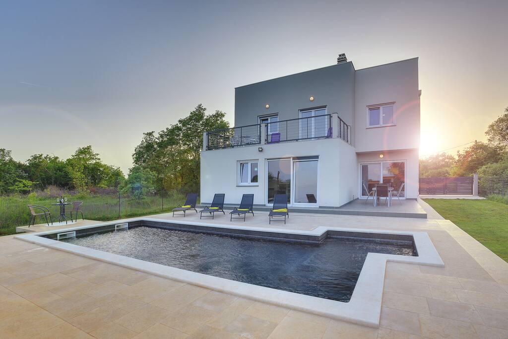 Swimming pool at sunset 2