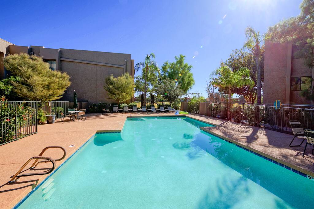 When in Scottsdale, take a dip...where a large community swimming pool with ample patio seating, await!