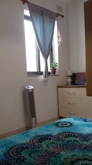 double bed with view to patio