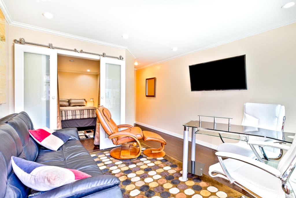 Enter through the front door into this lovely living room with a full size sofa/futon bed.