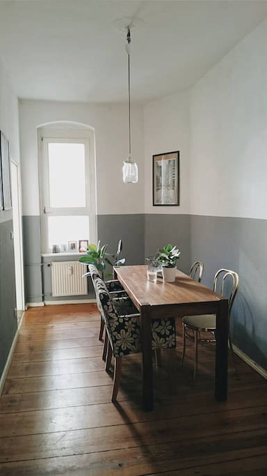 Dining room with the kitchen on the left side