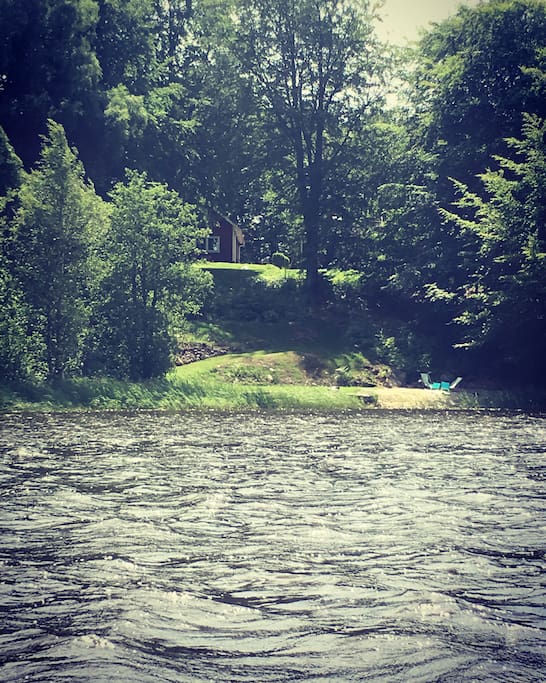 Photo taken from the lake in summer, the house is up on the hill!