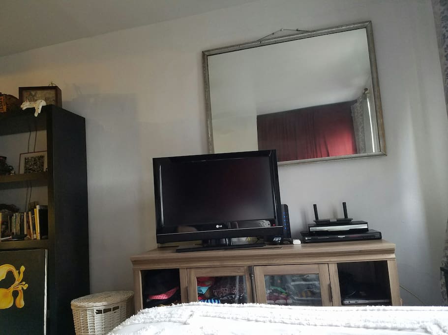 TV with cable at foot of bed