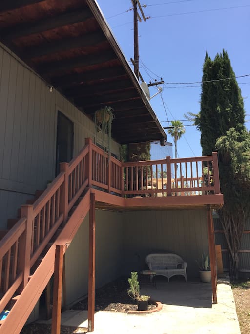 Enter up the stairs to your own private patio.