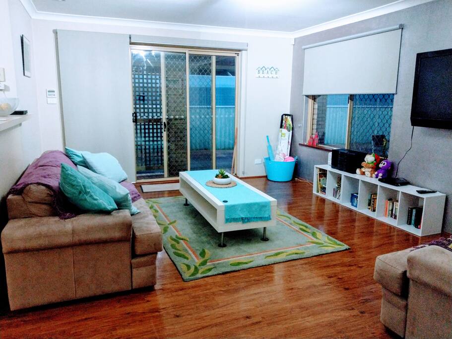 Living room. Wall mounted TV/DVD and toys