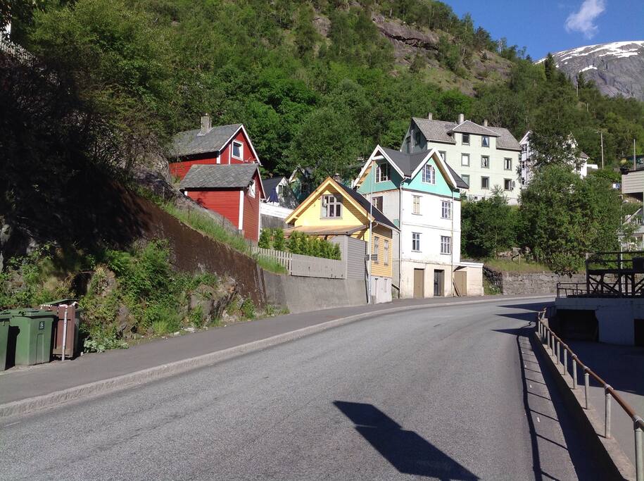 The guesthouse is the smallest of the red houses on the picture