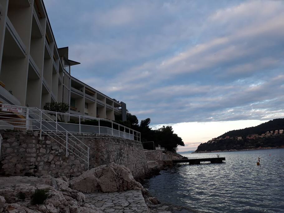 Stairs leading to apartment and private dock for building